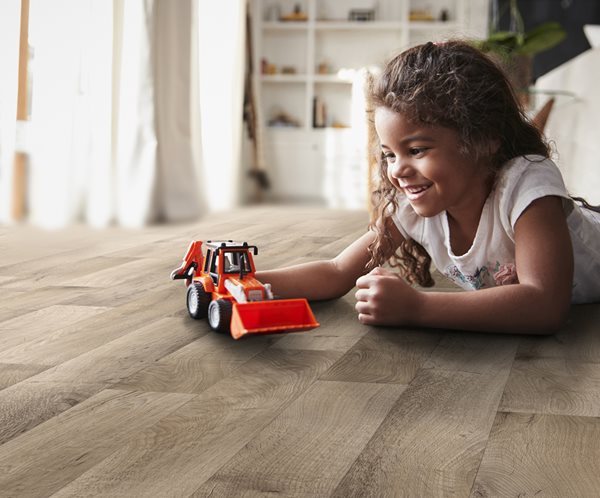 girl playing on luxury vinyl sheet flooring